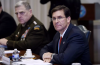 Mark Esper, right, who was secretary of defense in the first Trump administration, said the president was upset by Black Lives Matter protests in 2020 and asked Mark Milley, left, the chairman of the Joint Chiefs, “Can’t you just shoot them, just shoot them in the legs or something?” (Oiliver Douliery / AFP via Getty Images)