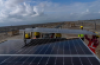 Workers install solar panels in the western state of Gujarat, India, in 2023. India saw record solar and wind power generation growth that outpaced the growth in demand in the first half of this year, according to a report by the global energy think-tank Ember. (Rafiq Maqbool/The Associated Press)