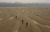 Residents transport drinking water from Humaita to the Paraizinho community, along the dry Madeira River, a tributary of the Amazon River, during the dry season, Amazonas state, Brazil, in September, 2024. Edmar Barros/The Associated Press