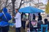 After Dr. Ryan Herriot, in the white coat, opened a pop-up overdose prevention site on Royal Jubilee Hospital grounds today, the site was moved off hospital grounds by hospital security teams to city property. Photo by Brishti Basu.