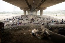 Homeless people sleep in the shade of an highway overpass on a hot day in New Delhi, last month.Manish Swarup/Associated Press