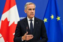 Mark Carney’s new omnibus bill belongs to a larger project aimed at reorganizing Canada around corporate priorities. It would give the state greater power over workers whose collective action can disrupt the transportation networks vital to that strategy. (Jean-Christophe Verhaegen / AFP via Getty Images)