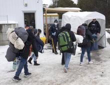 A family of asylum seekers from Colombia is met by RCMP officers after crossing the border at Roxham Road into Canada on Thursday, Feb. 9, 2023 in Champlain, File photo by The Canadian Press/Ryan Remiorz