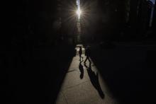 A new report from Statistics Canada says life expectancy for the average Canadian at birth has fallen for the last three years in a row, from 82.3 in 2019 to 81.3 years in 2022. Pedestrians walk through a sliver of sunlight in downtown Toronto on Wednesday, July 6, 2022. THE CANADIAN PRESS/Cole Burston