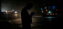 Resident looks at his cell phone during power failure in Havana, Cuba, October 20, 2024. Ramon Espinosa/AP