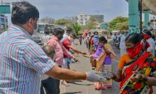  ‘There is no guarantee that this resurgence of collective action will survive the pandemic. But I think it will.’ People distribute free food in Bangalore, India. Photograph: Manjunath Kiran/AFP via Getty Images