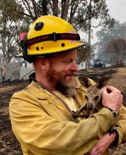 LTBMU Fire Captain Dave Soldavini, holds a baby kangaroo, known as a "Joey," that was rescued from the devastating 2019-20 wildfires in Australia, January 2020. Photo:Flickr/USDA Forest Service (CC BY 2.0)