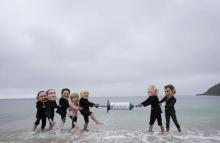 Activists wearing giant heads of the G7 leaders tussle over a giant COVID-19 vaccine syringe during an action of NGO's on Swanpool Beach in Falmouth, Cornwall, England, Friday, June 11, 2021. Leaders of the G7 begin their first of three days of meetings on Friday in Carbis Bay, in which they will discuss COVID-19, climate, foreign policy and the economy. Depicted from left to right, Japan's Prime Minister Yoshihide Suga, Italy's Prime Minister Mario Draghi, Canadian Prime Minister Justin Trudeau, German Cha