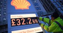 Greenpeace activists set up a mock gas station price board displaying Shell's net profit for 2022 outside of the company's headquarters in London on February 2, 2023. (Photo: Daniel Leal/AFP via Getty Images)