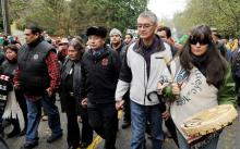 Protesters including Grand Chief Stewart Philip of the Union of B.C Indian Chiefs are escorted by police from an injunction area on Burnaby Mountain last November during test drilling by Kinder Morgan