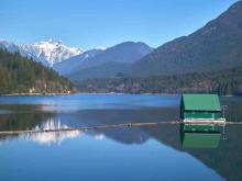 The Capilano reservoir in North Vancouver is contained by the Cleveland Dam. Despite appearances of plentiful water supply, journalist Tim Smedley warns many places in the world are headed for extreme scarcity. Photo via Shutterstock.