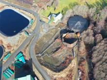 Toxins leak from a crumpled storage tank at the bankrupted Port Alice mill. Due to lax regulations, the BC public will pay for cleanup. Photo via PricewaterhouseCoopers.