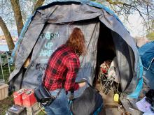 Fiona York, an advocate for people living in a homeless encampment in Vancouver’s Crab Park, outside the community’s warming tent in the spring of 2022. Photo for The Tyee by Jen St. Denis.