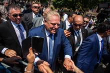 Ontario Premier Doug Ford greets a crowd gathered in Toronto to celebrate his swearing-in ceremony on June 29, 2018. Photo by Alex Tétreault