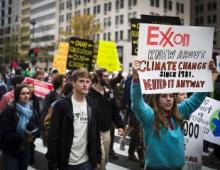 Exxon climate protesters during climate rally march in Washington, D.C., November 10, 2015. Photo Credit: Johnny Silvercloud/Flickr CC