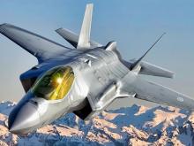 Why should Canadians pay for more F-35 fighters like this one made by a United States menacing our economy? Photo via Lockheed Martin.