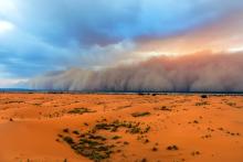 Sandstorm approaching Merzouga Settlement in Erg Chebbi Desert, Morocco. Pavliha/Getty Images