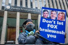 Activists from Rise and Resist, Truth Tuesdays and Extinction Rebellion gathered in the public space in front of Fox Headquarters in Manhattan to protest the network's ongoing propagation of dangerous climate lies, as part of Earth Week on April 19, 2022. Erik McGregor / LightRocket via Getty Images