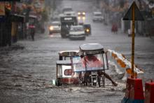 Motorists navigate a flooded highway during the onslaught of Typhoon Kammuri on December 3, 2019 in Lipa town, Batangas province, Philippines. (Ezra Acayan / Getty Images)