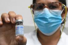 A medical worker displays a dose of Cuba’s Soberana 2 vaccine against COVID-19 at a school in Havana, Cuba. (Joaquin Hernandez / Xinhua via Getty Images)