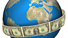 globe encircled by US dollars