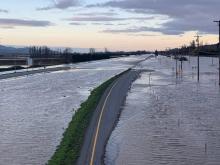 Flooding is natural to the Lower Mainland. But with climate change and communities building so close to the water, people are increasingly exposed to disaster. Photo of Highway 1 near Chilliwack during the November 2021 floods courtesy of the BC government via Flickr, CC BY-NC-ND 2.0.