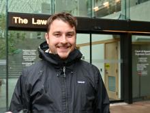Drug User Liberation Front co-founder Jeremy Kalicum in front of Vancouver’s provincial court today. Photo for The Tyee by Michelle Gamage.