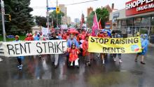 The York South-Weston Tenant Union holding a rally on Weston Road in Toronto, after they decided to withhold rent from their landlord. Hundreds of tenants showed up to the late July rally. (Photograph by Jared Ong)