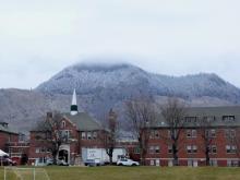 The former Kamloops Indian Residential School became the focus of an outpouring of grief, as well as the target of skepticism, after the Tk̓emlúps te Secwépemc Nation announced ground-penetrating radar had found approximately 200 possible unmarked graves in 2021. Photo for The Tyee by Emily Enns.