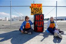 RICHMOND – Police arrested two protesters blocking a gate at the Kinder Morgan Terminal in Richmond on Monday morning, during a demonstration against the company’s planned expansion of the Trans Mountain Tar Sands Pipeline in Canada.  After the arrests at about 10 a.m., two other gates were still blocked at the facility on Canal Boulevard, but police said they would not be taking any others into custody.  Early Monday, about a dozen protesters had secured themselves to oil barrels and had 12-foot-long mock 