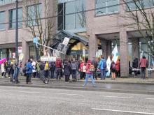 Members of the BC Teachers Federation (BCTF) protested in Vancouver on Wednesday, calling for a "fossil-free and weapons-free portfolio." (Raynaldo Suarez, CityNews)