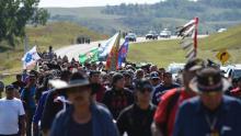 Protestors march to a construction site for the Dakota Access Pipeline to express their opposition to the pipeline, at an encampment where hundreds of people have gathered to join the Standing Rock Sioux Tribe's to protest against the construction of the new oil pipeline, near Cannon Ball, North Dakota, on September 3, 2016. (Robyn Beck/AFP/Getty Images)