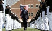 U.S. President Barack Obama walks through an honor cordon as the arrives for the 134th Commencement Exercises of the United States Coast Guard Academy in New London, Connecticut May 20, 2015. REUTERS/KEVIN LAMARQUE