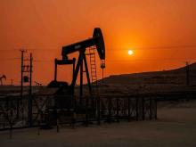 An oil rig in Bahrain. The war in nearby Iran is driving unprecedented profits for Canada’s fossil fuels industry and those revenues should be taxed to support public services, writes the author. Photo via Shutterstock.