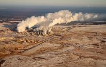 The actual number of tonnes of GHGs sent into the atmosphere by the oilsands keeps going up. Photo of Alberta’s oilsands by Kris Krug, Creative Commons licensed.