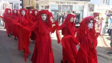 The Red Brigade first showed up last year at Extinction Rebellion protests in the United Kingdom. GAZAMP