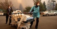 Patients were quickly evacuated from Feather River Hospital as it burned during the Camp Fire in Paradise, California, on Nov. 8, 2018. (Josh Edelson/AFP via Getty Images)