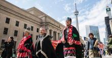 Wet’suwet’en nation hereditary Chief Namoks (right) walks with Chief Gisdaya (centre) and Chief Madeek while in Toronto for the Royal Bank of Canada annual general meeting, on Thursday, April 7, 2022. (Christopher Katsarov / Canada's National Observer)