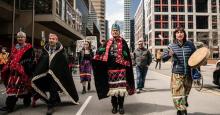 Wet’suwet’en nation hereditary Chief Namoks walks with Chief Gisdaya, Chief Madeek, and Wing Chief Sleydo' while in Toronto for the Royal Bank of Canada annual general meeting on April 7, 2022. Photo by Christopher Katsarov / Canada's National Observer