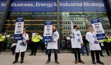 Scientists for Extinction Rebellion demonstrate outside the Department for Business, Energy and Industrial Strategy in London. Photograph: Tolga Akmen/AFP/Getty Images