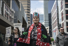 Wet'suwet'en Hereditary Chief Namoks marches with delegates and supporters while in Toronto for RBC's annual general meeting on Thursday, April 7, 2022. Photo by Christopher Katsarov / Canada's National Observer