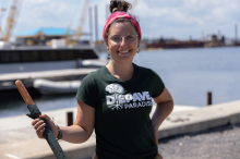 Emily Amon, 26, the green infrastructure programs lead at Green Communities Canada, at a Depave project at Wolf Island Pier near Kingston, Ont. Photo by Mitch Bowmile / North Country Media House