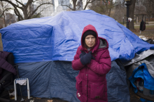 Lynn Walker, 63, cleans up around her home in a homeless encampment in Allan Gardens park in Toronto on Dec. 1, 2022. Photo by Ian Willms for Canada's National Observer