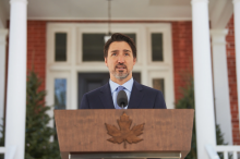 Prime Minister Justin Trudeau speaks to reporters outside Rideau Cottage on March 18, 2020. File photo by Kamara Morozuk