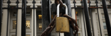 A lock is seen on a gate on the exterior of the U.S. Department of Treasury building as they joined other government financial institutions to bail out Silicon Valley Bank's account holders after it collapsed on March 13, 2023 in Washington, DC. (Photo by Chip Somodevilla/Getty Images)
