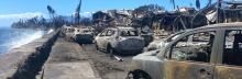 Burned cars and destroyed buildings are pictured in the aftermath of a wildfire in Lahaina, western Maui, Hawaii on August 11, 2023. (Photo by Paula Ramon / AFP)
