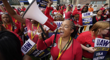 Photo: United Auto Workers member Tasha Johnson leads a chant during a rally in Detroit, Michigan, on Sept. 15, 2023. AP Photo/Paul Sancya.