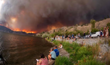 People watch the McDougall Creek wildfire in West Kelowna, British Columbia, Canada, in August 2023. Photograph: Darren Hull/AFP/Getty Images