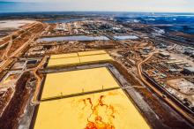 An aerial oilsands image. While cloaking their calls for relief around affordability, carbon-pricing critics are helping the oil and gas industry profit off the backs of people in Canada for as long as possible. Photo by Shutterstock