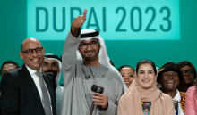 The UN climate chief, Simon Stiell (left); the Cop28 president, Sultan al-Jaber; and Hana al-Hashimi, the chief Cop28 negotiator for the UAE, pose for photos at the end of Cop28. Photograph: Peter Dejong/AP